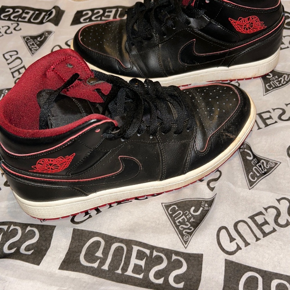 Black Jordan One’s with red highlights